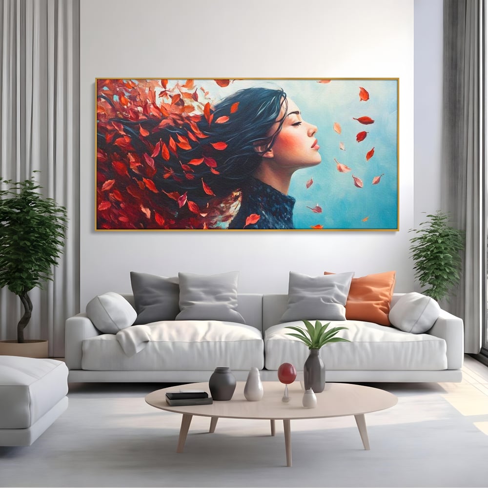 Tablou canvas cu tablou canvas cu femeie si frunze in vant, in rama de aluminiu auriu, pe perete intr-un living